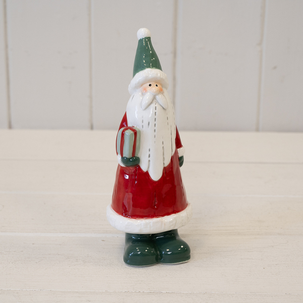 Ceramic Springtime Santa Ceramic Red Santa Holding a Present Large | Satchville